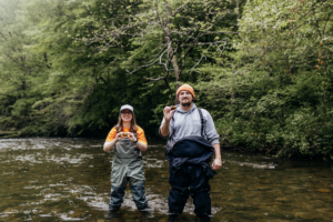 Two students at Abrams Creek identifying mussel species